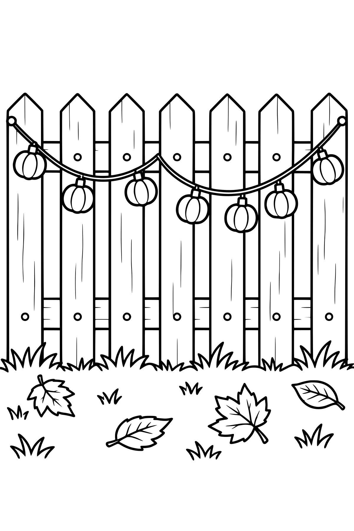 Pumpkin-shaped lights hanging in curved strands across a pointed wooden fence, with grass and fallen autumn leaves below.