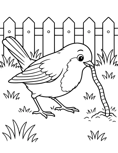 Bird gripping a long worm in its beak beside grass and a pointed picket fence.