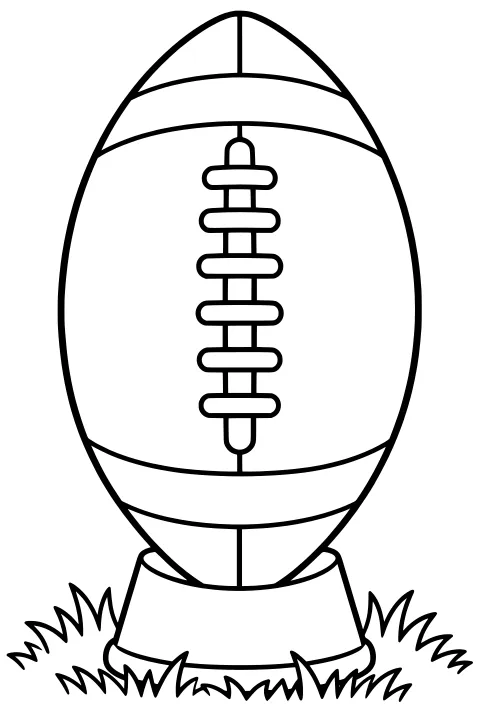 Upright football with central laces and curved panel seams resting on a kicking tee surrounded by tufts of grass.